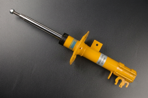 Yellow shock absorber on a gray background